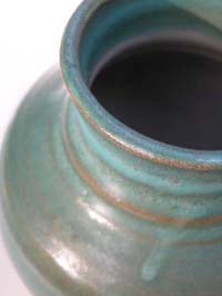 Detail of jade colored vase from the top